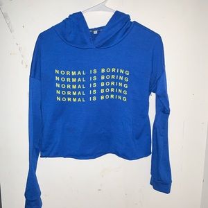 Blue “Normal is boring” crop top